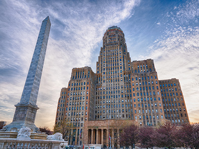 Big building with an obelisk in front